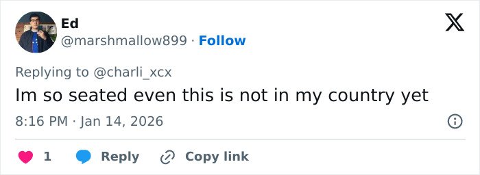 User comment on social media expressing surprise about Charli XCX braless photo dump not being available in their country yet.