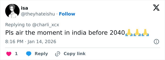 Twitter user replying to Charli XCX, referencing a moment in India with prayer hand emojis in a tweet.