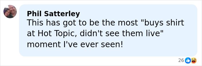 Facebook comment by Phil Satterley reacting humorously, referencing a Hot Topic shirt moment with emojis.