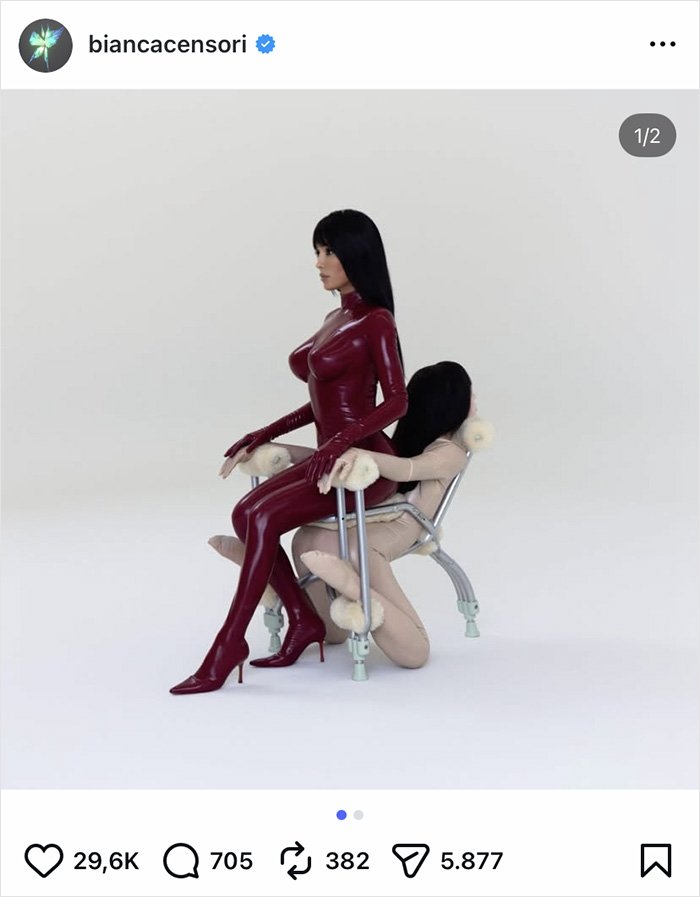 Bianca Censori wearing sleek pants and high heels in a striking red outfit posing with an artistic chair setup.