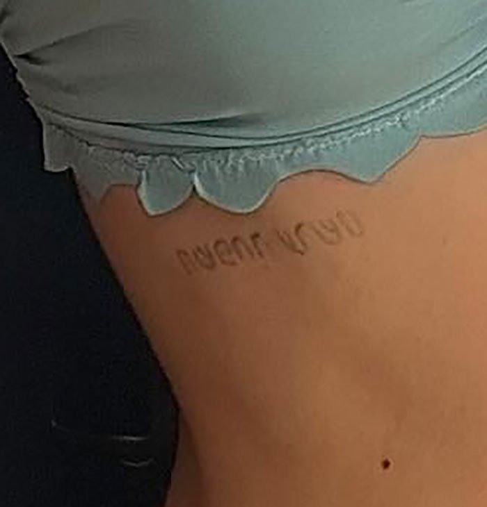 Close-up of Nicola Peltz's tattoo on her side, highlighting a pointed message related to the Beckham family.