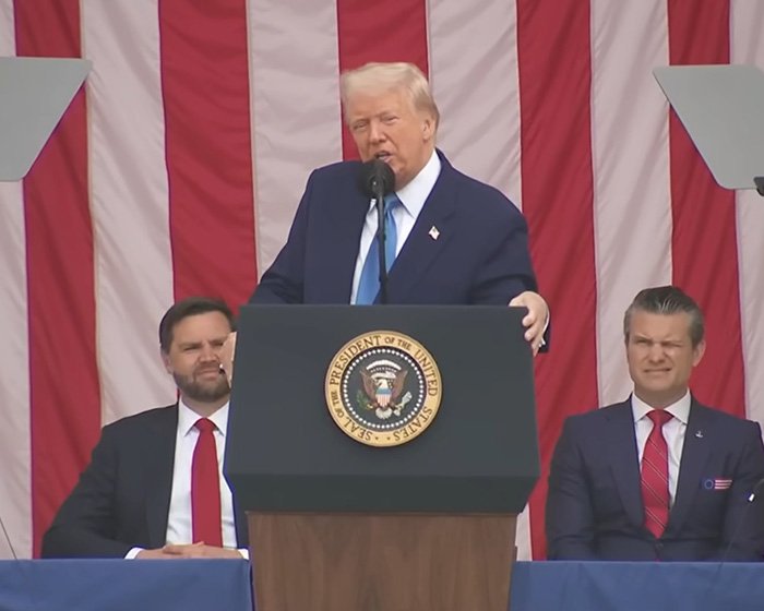Donald Trump speaking at a podium with the presidential seal, addressing health speculation concerns during a public event.