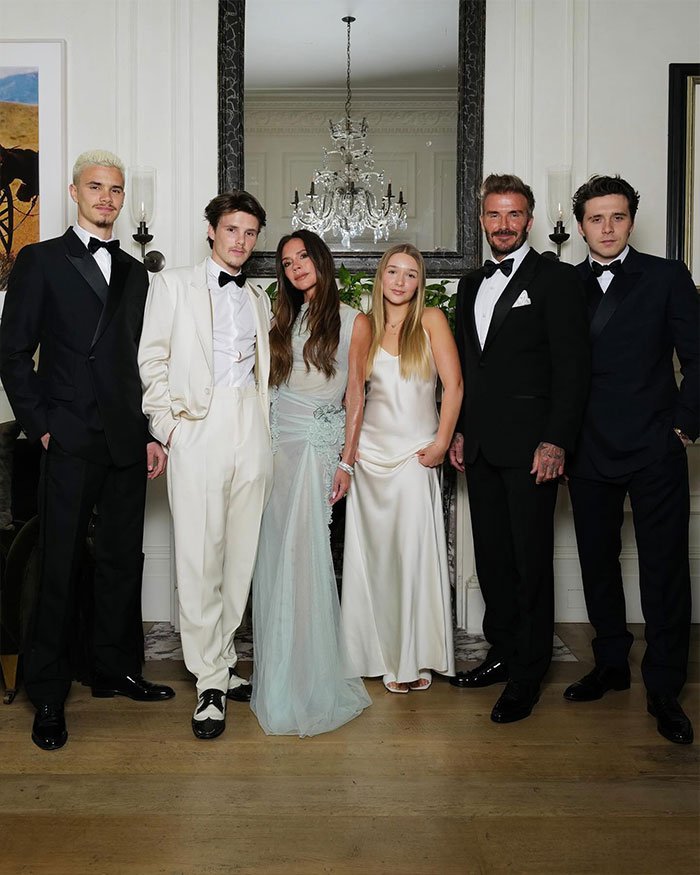 David Beckham’s family dressed formally at an event, with emphasis on Brooklyn Beckham and a group portrait setting.