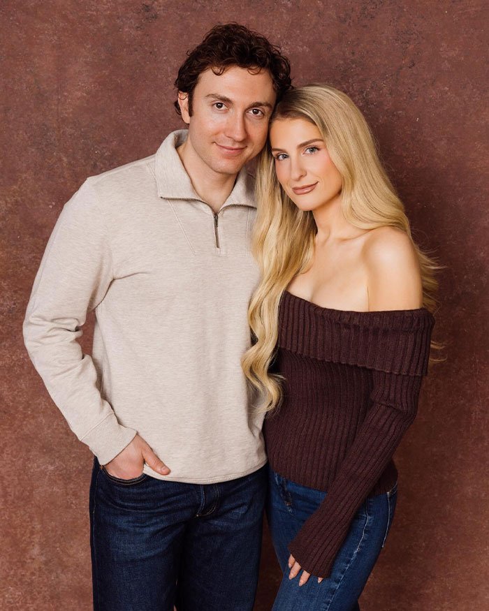Meghan Trainor and a man posing together, with Meghan explaining why she used a surrogate for her baby.