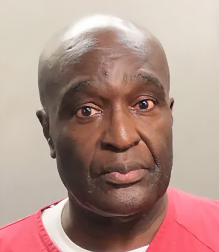 Close-up of a man in red prison clothing with a serious expression related to five-year-old’s chilling last words disappearance case in Alligator Alley.