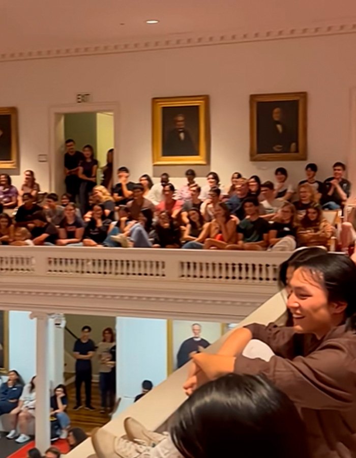 Students gathered in a crowded Amherst College hall during a controversial orientation event sparking backlash and administrative firings.