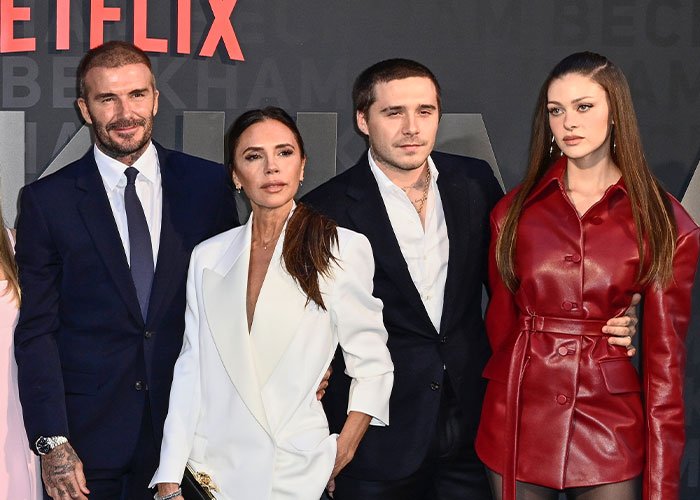 Victoria Beckham and Brooklyn Beckham pose with Nicola Peltz at a Netflix event, highlighting sister of Nicola Peltz's ex incident.