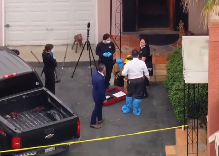 Crime scene investigators examining area outside home with yellow tape after teacher’s life ends following explosive diary discovery.