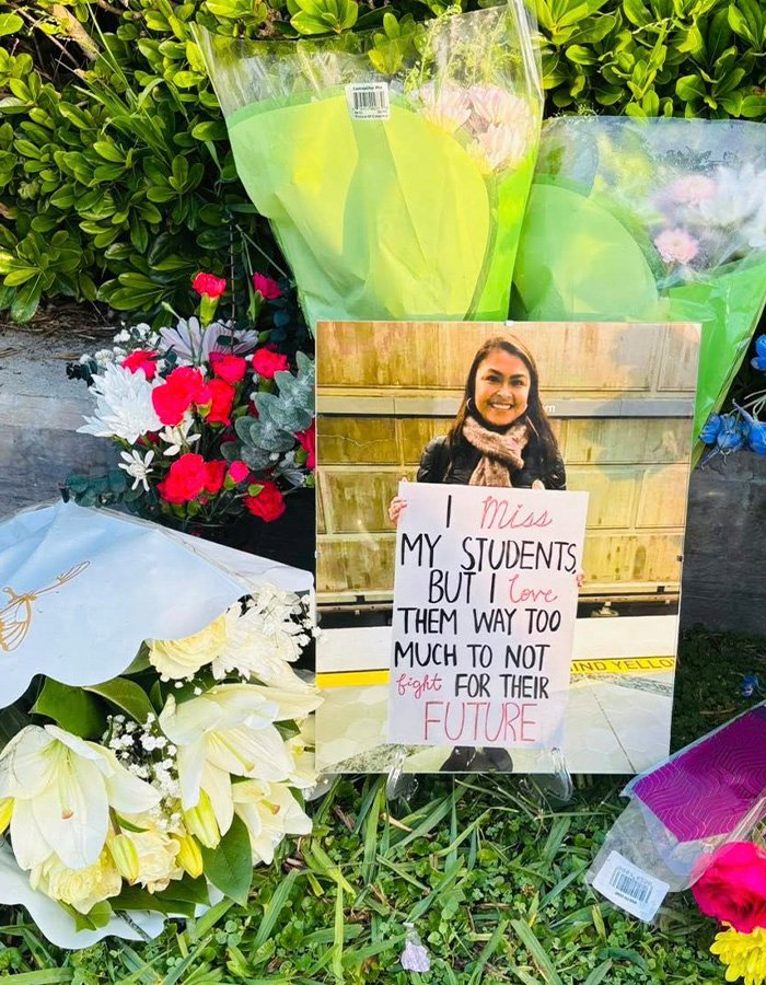 Memorial with flowers and photo of a teacher, highlighting teacher’s life and impact after diary discovery of affair.