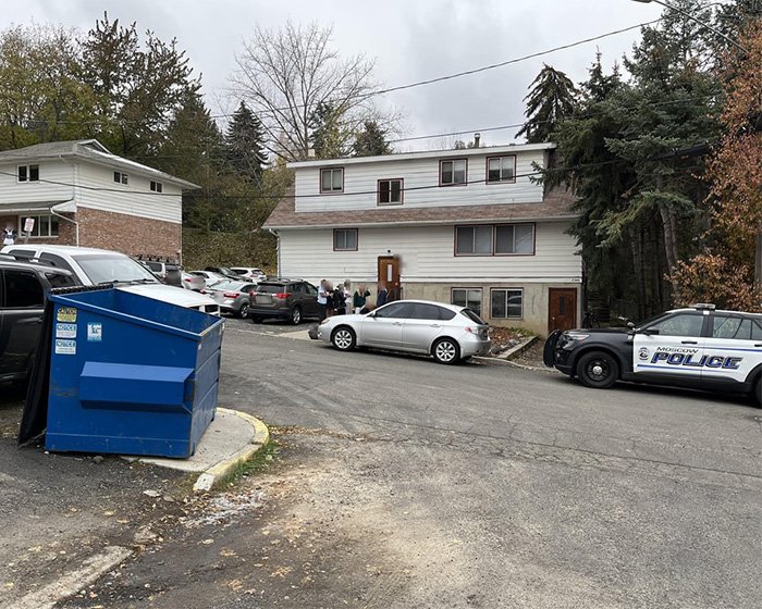 Police vehicles and investigators outside a residential area linked to disturbing new details in Bryan Kohberger autopsy reports.