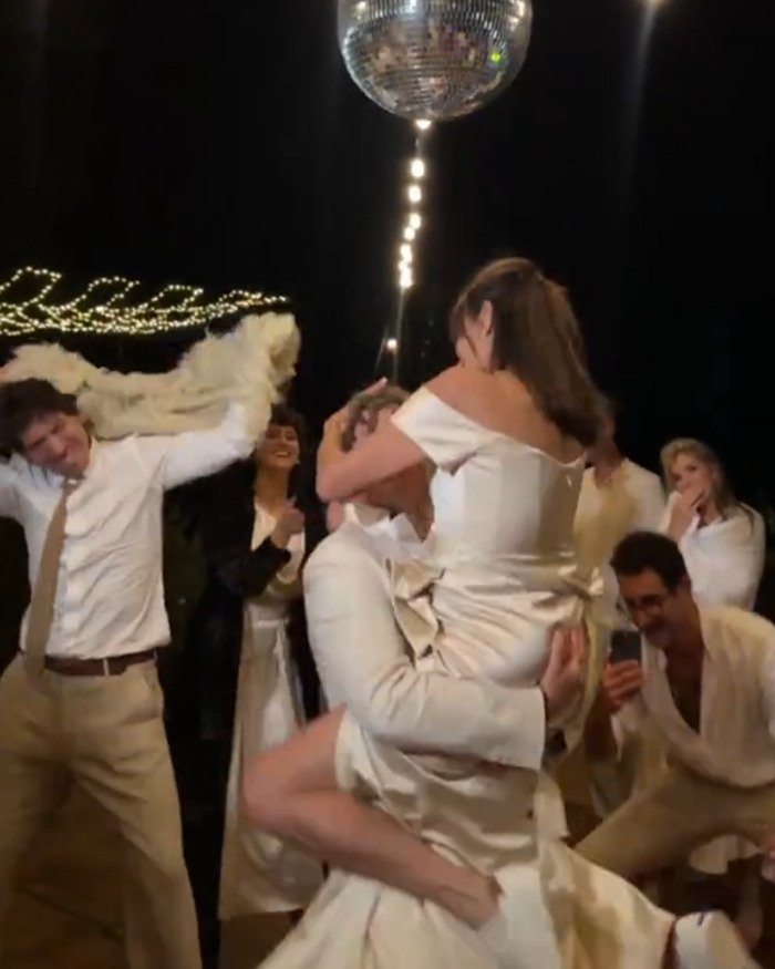 Groom’s mom dances wildly at wedding under disco ball with guests cheering during lively celebration amid Beckham family fallout.