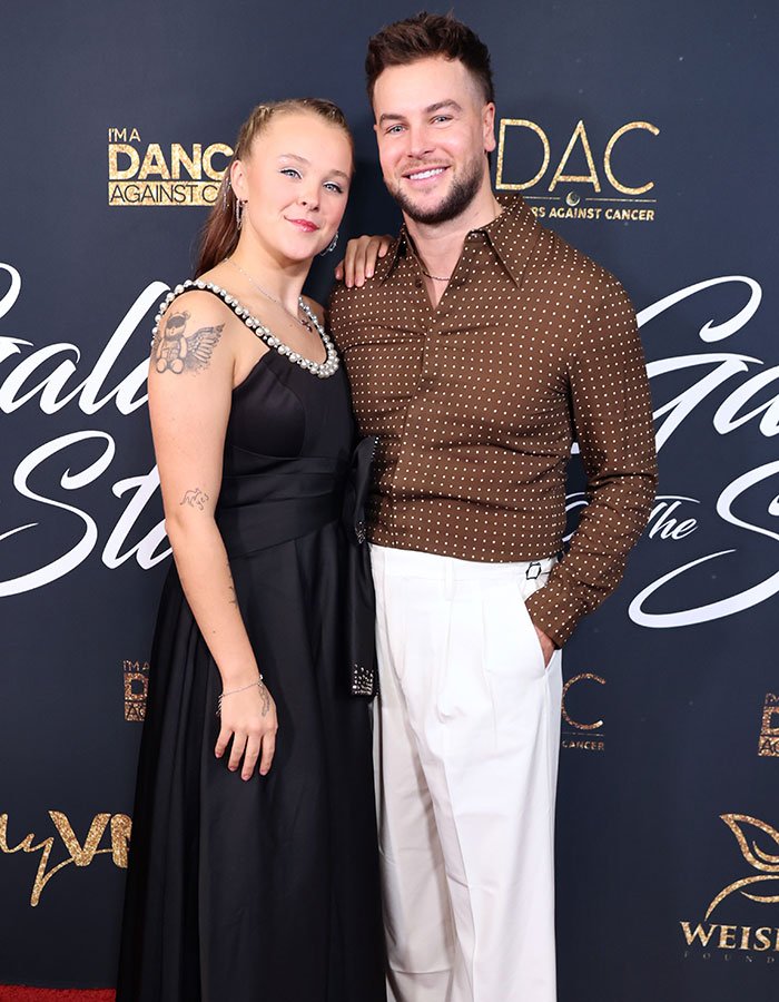 JoJo Siwa and companion posing at a gala event highlighting JoJo Siwa's latest confession and massive transformation.
