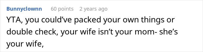 Screenshot of a Reddit comment criticizing a man blaming his wife for having no slacks for his business trip.