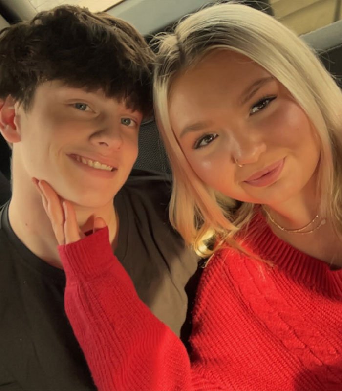 Teen siblings smiling together indoors, highlighting family impact as 15-year-old gets pregnant with 12-year-old’s child.