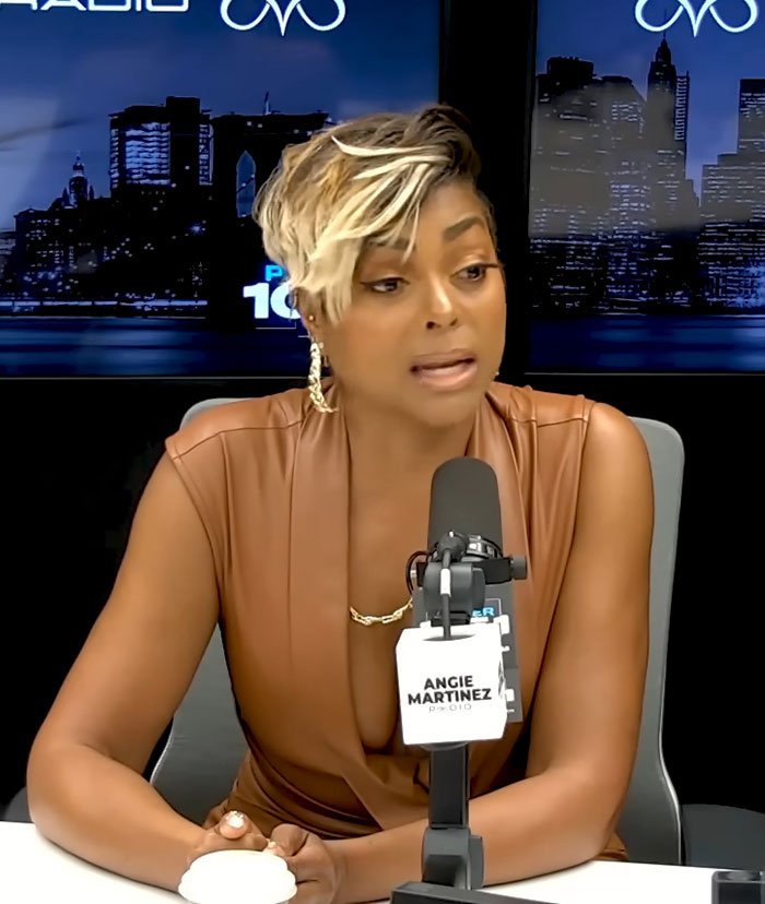 Taraji P. Henson with short blonde hair speaking into a microphone during a radio interview about face changes.