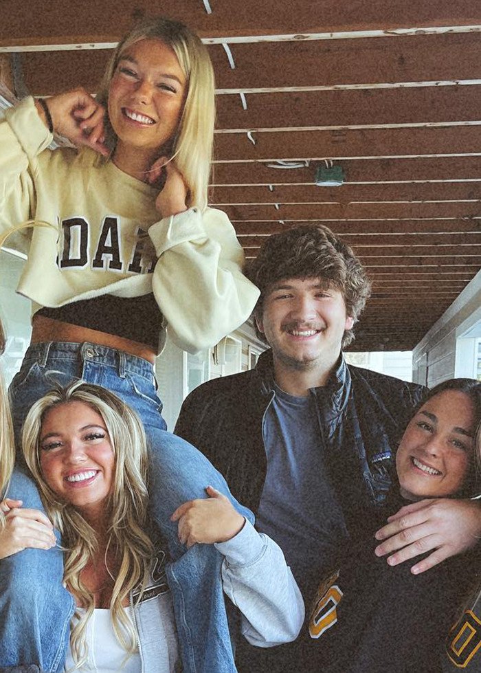 Group of young people smiling together, related to disturbing new details about Bryan Kohberger victims' final moments revealed.