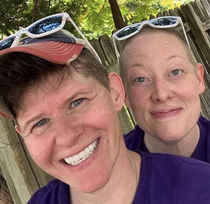 Couple outdoors wearing sunglasses, representing Renee Good’s wife breaking silence on fatal ICE incident in community.