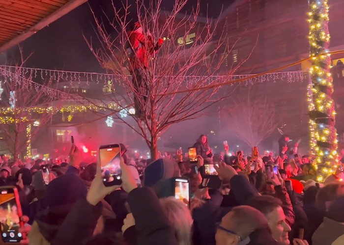 Crowd capturing video with phones at a ski resort explosion site as survivors reveal cause of the deadly incident.