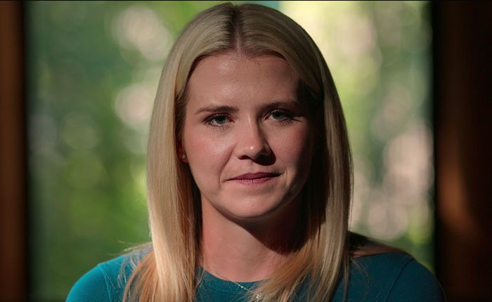 Woman with blonde hair in a blue shirt sharing insights about Elizabeth Smart Netflix documentary Kidnapped.
