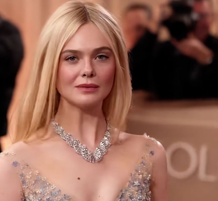 Elle Fanning at a glamorous event showcasing height and style, highlighting women are getting bigger trend.