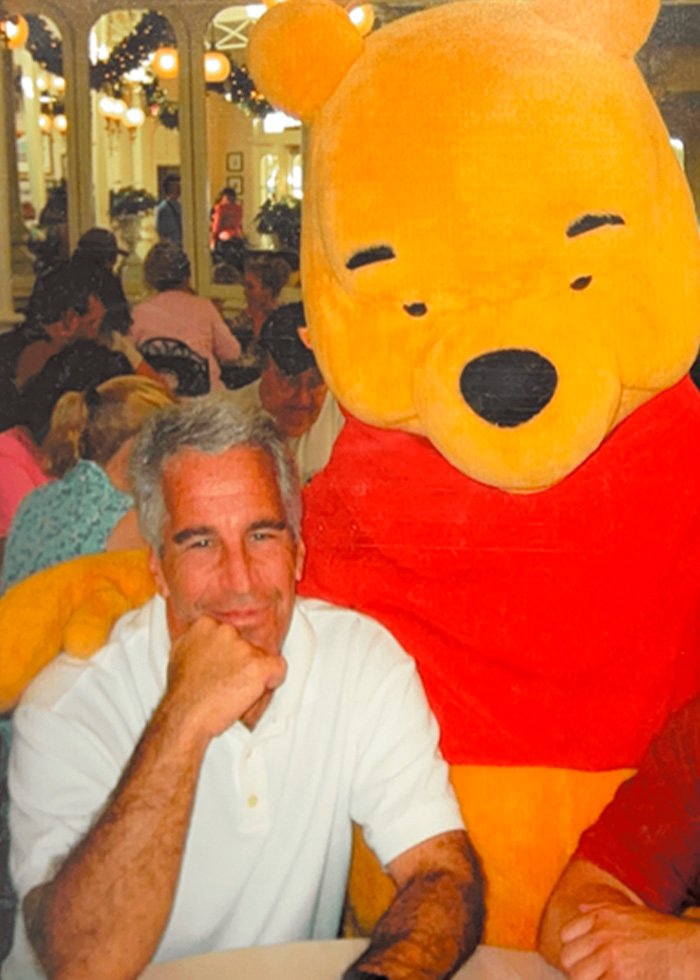 Image showing a man seated next to a large Winnie the Pooh character, related to Michael Jackson’s chilling thoughts on children.