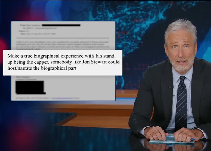 Jon Stewart on a news set, addressing the Epstein files controversy during a televised segment.