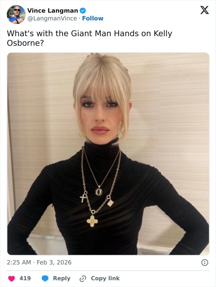 Kelly Osbourne posing indoors in a black turtleneck, sparking fan concern over odd detail in photo.