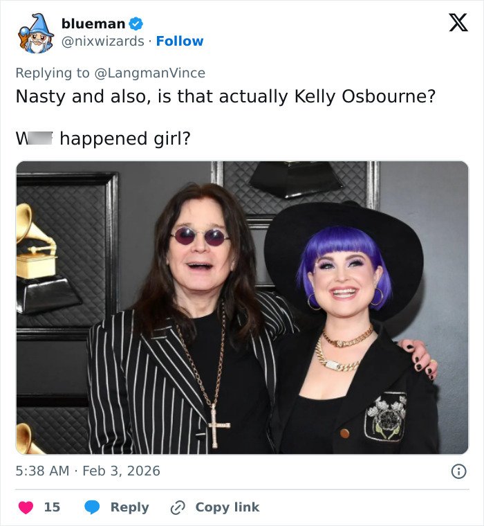 Kelly Osbourne smiling with purple hair and black hat next to man in striped jacket, fan concern about needs to see a doctor.