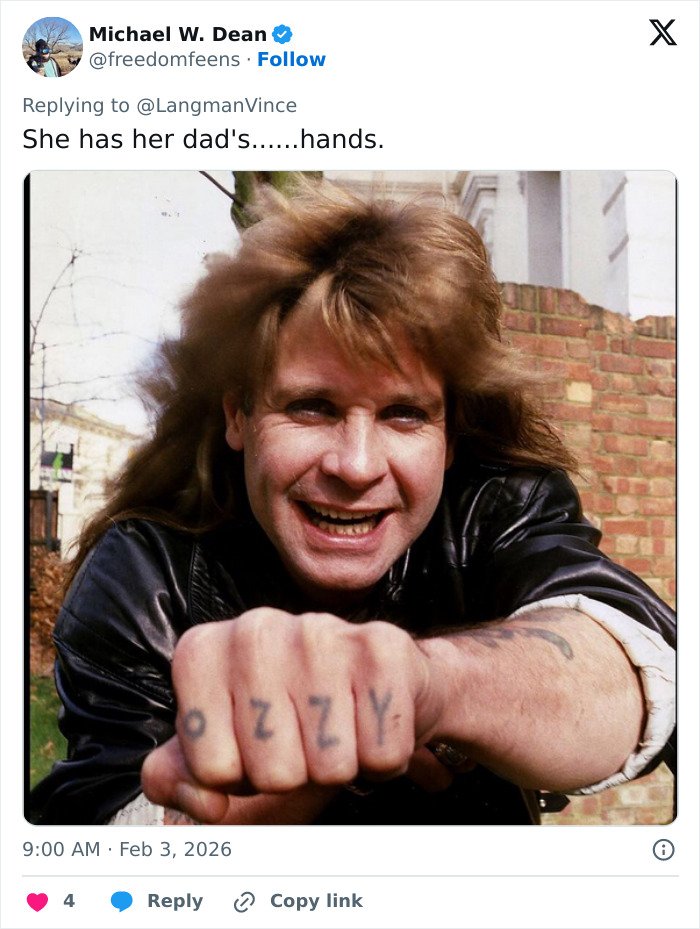 Man with long hair and leather jacket showing tattooed knuckles, photo related to needs to see a doctor fan concern