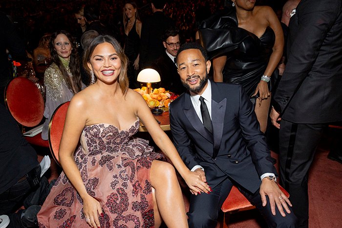 A Grammy seatfiller dressed elegantly at the event, highlighting the strict rules they face during the ceremony.