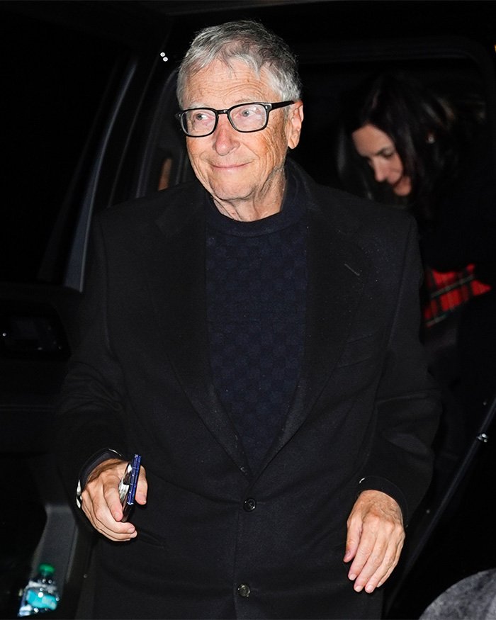 Bill Gates wearing glasses and a black coat leaving a vehicle amid Epstein files and Melinda French Gates claims.