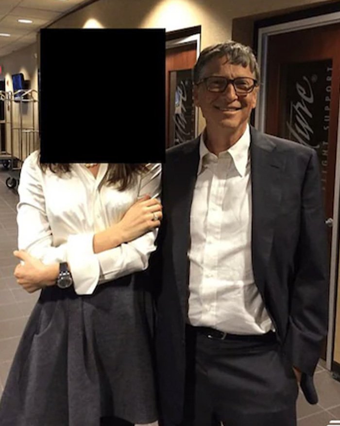 Bill Gates and Melinda French Gates smiling together in a hallway, discussing Epstein files and related claims.
