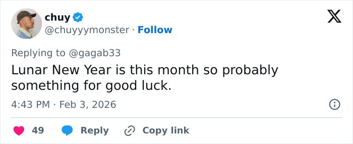 User reply on social media about good luck theory behind celebrities with $2 bills at the Grammys event.
