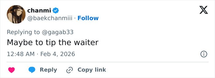 Screenshot of a Twitter reply commenting on celebrities spotted with $2 bills at the Grammys.
