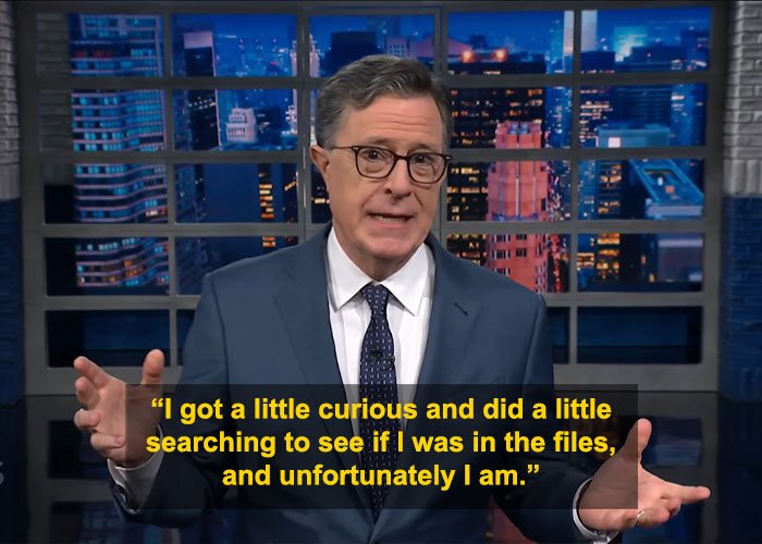 Stephen Colbert wearing glasses and a suit delivering a brutal response after appearing in Epstein files on a late night show.