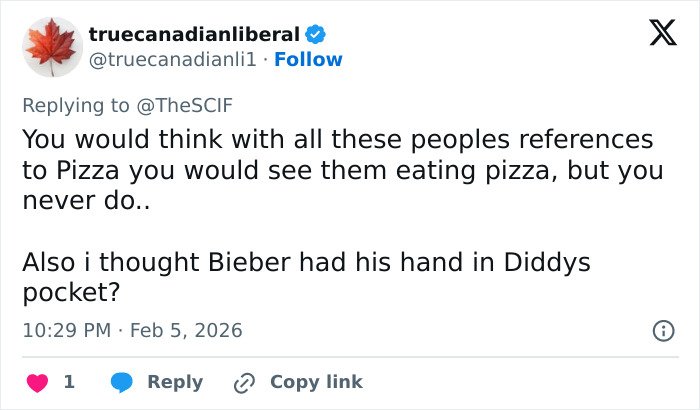 Screenshot of a Twitter reply discussing Justin Bieber and references to pizza amid Epstein conspiracy theory linked to Yummy video.