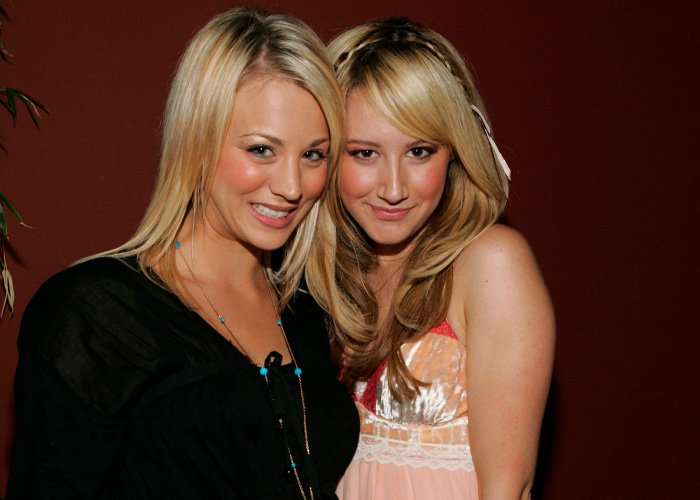 Two smiling women posing together indoors, highlighting the toxic mom drama and Kaley Cuoco’s confrontation with Ashley Tisdale.