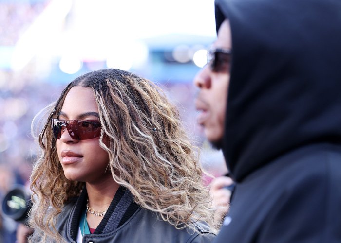Beyoncé at the Super Bowl wearing sunglasses, highlighting Blue Ivy's strong resemblance to her in genetics.