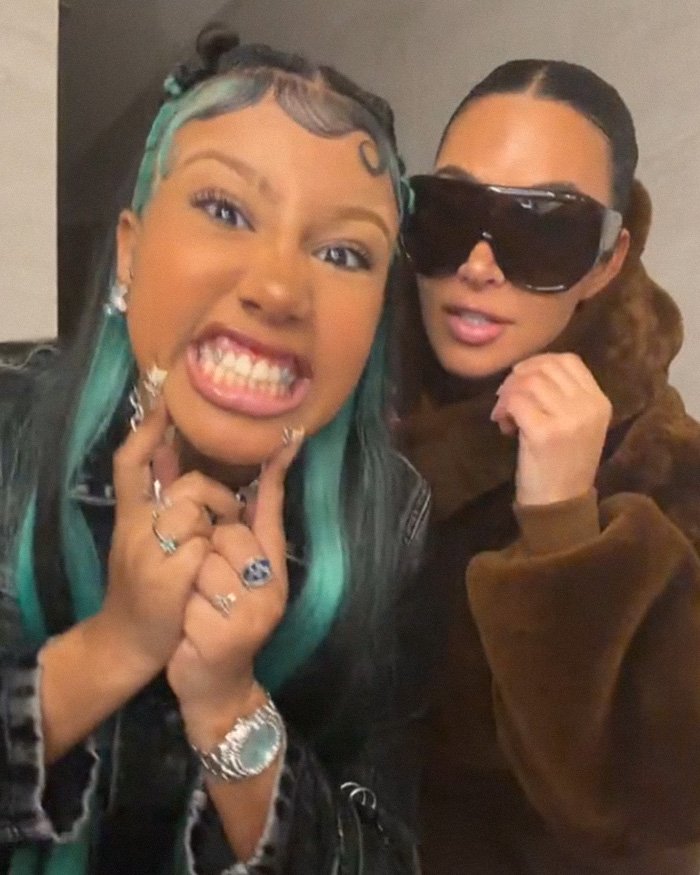 Kim Kardashian with a young woman showing off recent piercings, highlighting a disturbing development noticed by fans.