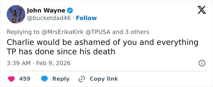 Tweet from John Wayne replying to Erika Kirk about Turning Point USA’s alternate halftime show controversy.
