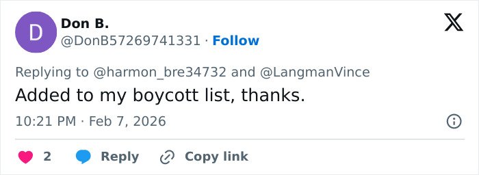 Screenshot of a social media reply showing backlash and threats related to Amber Glenn's beliefs.