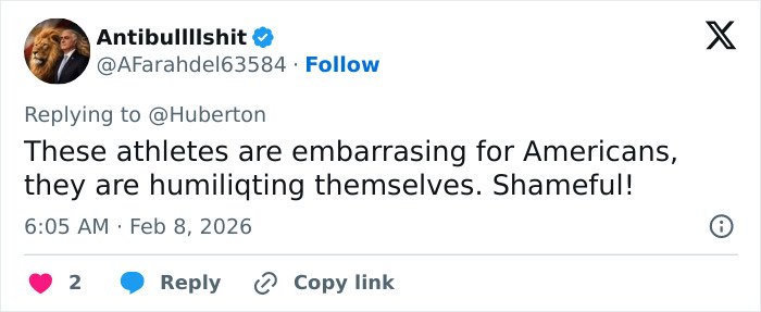 Screenshot of a social media reply showing backlash and threats related to Amber Glenn’s beliefs and public statements.