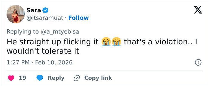 Tweet by user Sara reacting emotionally to a controversial low-cut dress advertisement causing online backlash.