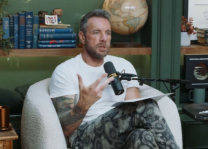 Dax Shepard speaking into a microphone during a podcast episode discussing why he&rsquo;s not a fan of Kristen Bell.