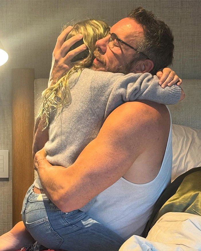Dax Shepard hugging a child, sharing a tender moment while expressing why he&rsquo;s not a fan of Kristen Bell.