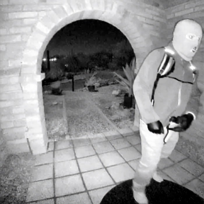 Masked kidnapper caught on night surveillance near archway as police use bitcoin exchange to gain control in crime case.