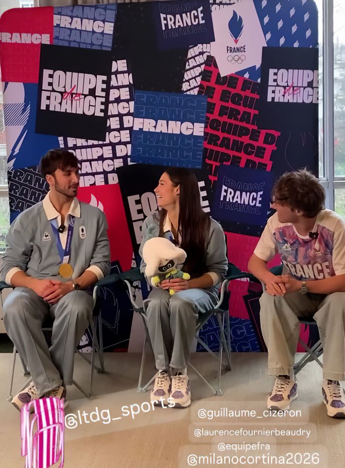 Three athletes in France team outfits seated in front of a backdrop, discussing French skater and Olympics cheating scandal.