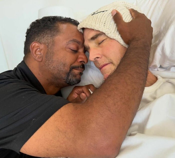 Alfonso Ribeiro tenderly embracing James Van Der Beek in an intimate moment of farewell and emotional connection.