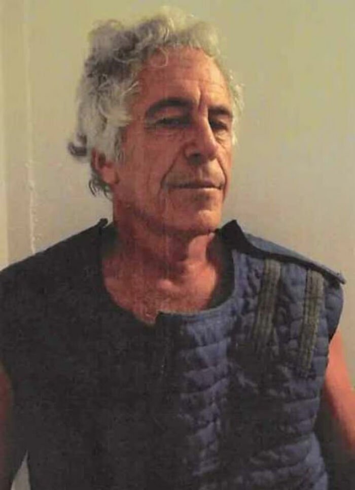 Man with gray curly hair wearing a dark padded vest, related to doctor at Jeffrey Epstein's post mortem claim