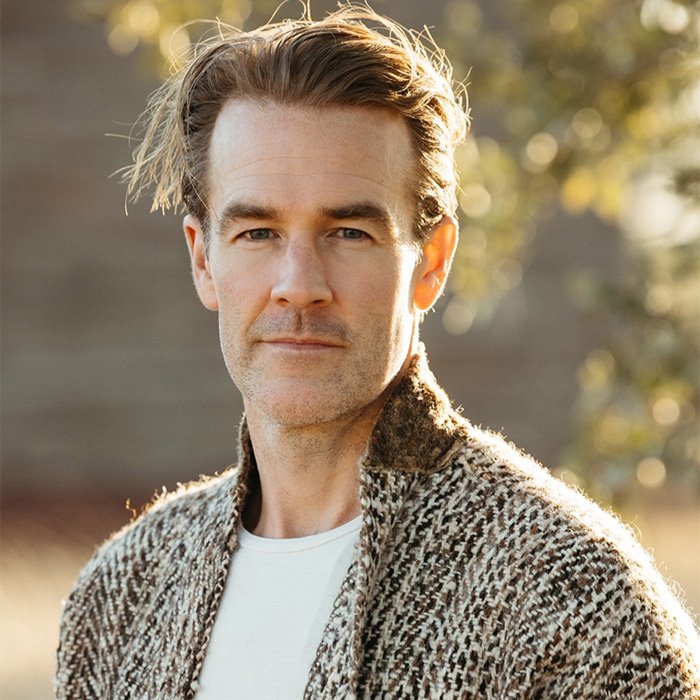 Middle-aged man outdoors in a patterned sweater, illustrating discussion about commonly ignored colorectal cancer symptoms.